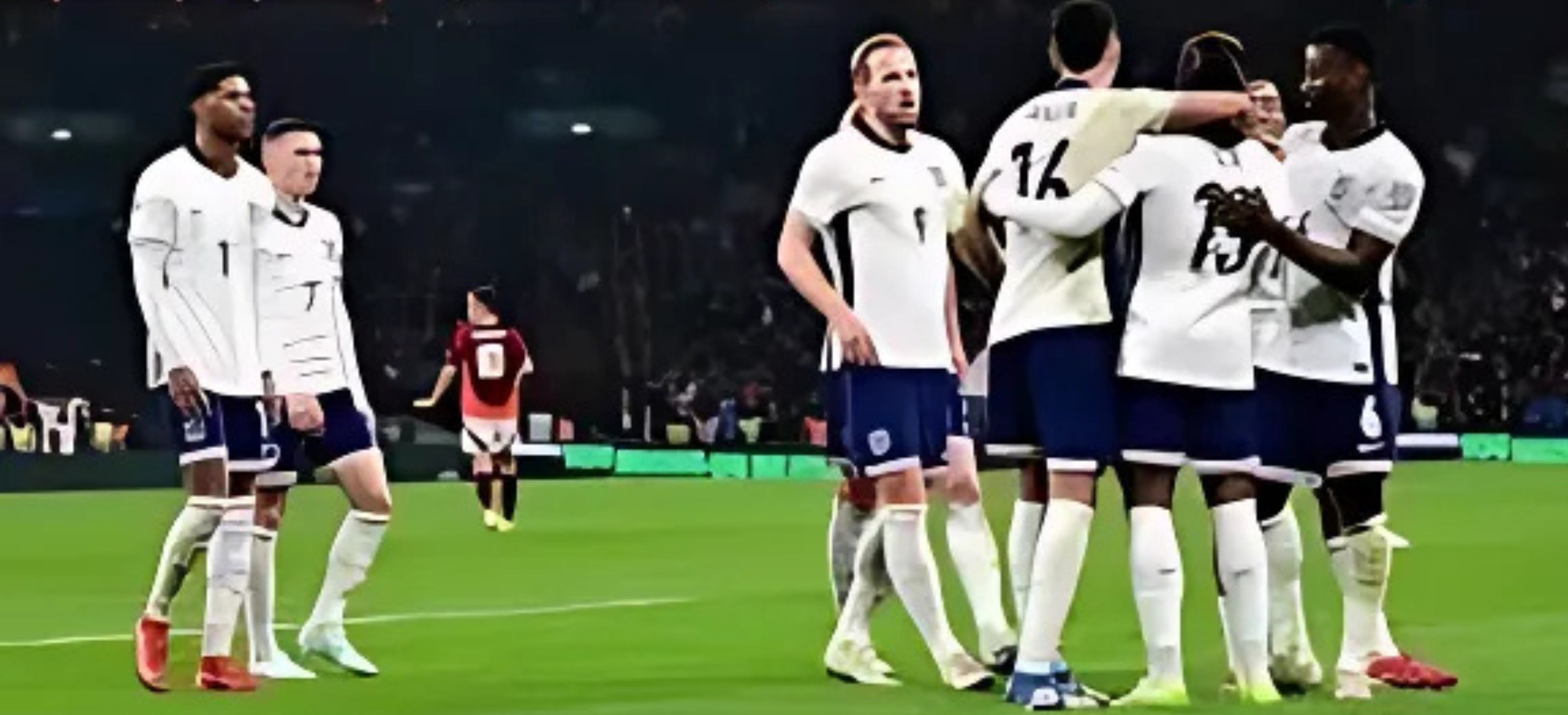 "Para pemain sepak bola berpakaian putih merayakan kemenangan di lapangan setelah mencetak gol."